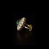 Emerald Halo Ring A vivid emerald takes center stage, encircled by radiant diamond polki and brilliant diamonds, creating a timeless statement of refined luxury.(KMR0180)