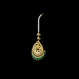 Adorn your look with this elegant Ekposta Maangtika featuring uncut diamond Polki, beautifully strung with emerald maniya and pearls.(KMTK0226)