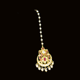Enhance your bridal charm with this stunning maangtika, featuring uncut diamonds and vibrant rubies, beautifully strung with pearls.(KMTK0227)
