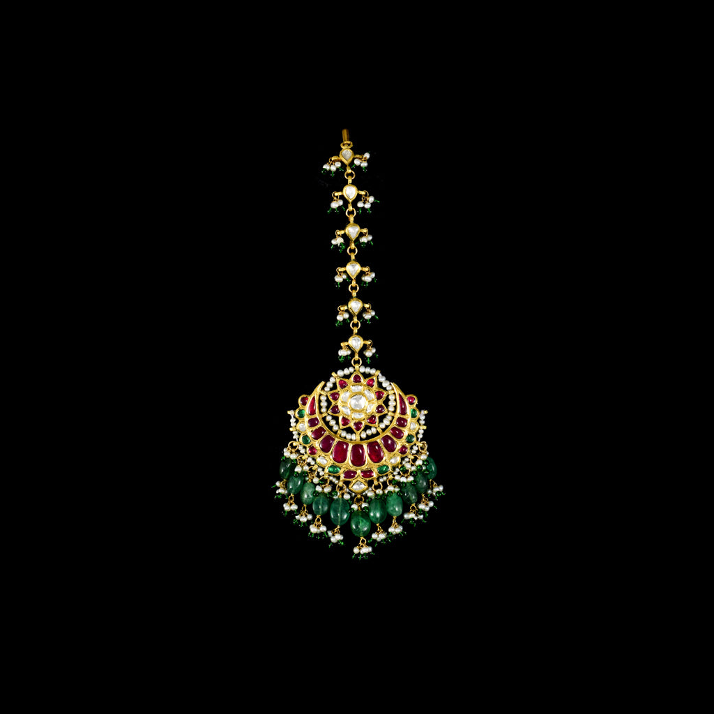 Exquisite maangtika featuring uncut diamond Polki and rubies, beautifully strung with emerald beads and pearls for a regal, traditional touch.(KMTK0241)