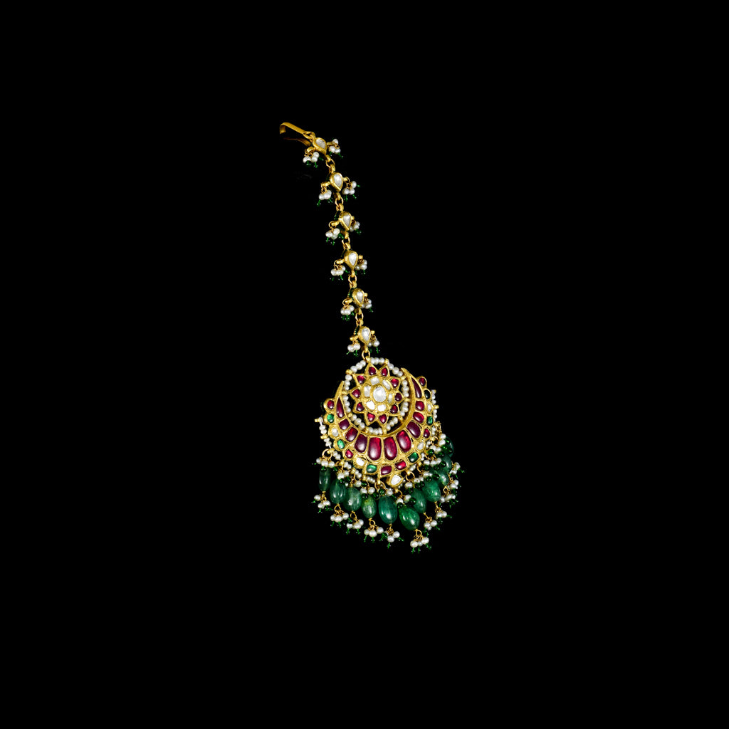 Exquisite maangtika featuring uncut diamond Polki and rubies, beautifully strung with emerald beads and pearls for a regal, traditional touch.(KMTK0241)