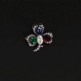 An heirloom-worthy floral brooch crafted with luminous Diamond Polki, vivid emerald, ruby, sapphire, and brilliant diamonds.(NP391)