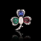 An heirloom-worthy floral brooch crafted with luminous Diamond Polki, vivid emerald, ruby, sapphire, and brilliant diamonds.(NP391)