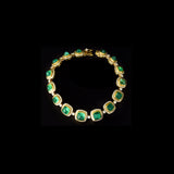 Beautiful emerald cabochons and sparkling diamonds come together in this elegant bracelet, making it a perfect piece to add charm, style, and everyday luxury to your jewelry collection.(PGDBR044)