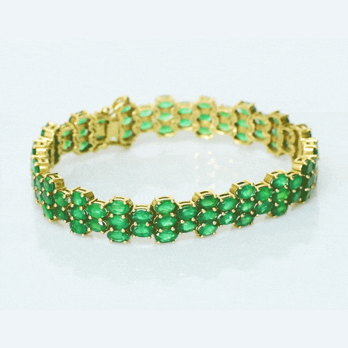 Vivid green emeralds arranged in a graceful flow, highlighted with subtle diamond brilliance for a sophisticated finish. (PGDBR063)
