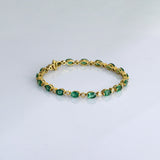 Graceful and elegant, this bracelet features vibrant emeralds paired with sparkling diamonds, creating a timeless design that adds beauty, charm, and a touch of luxury to any look.(PGDBR064)