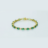 Graceful and elegant, this bracelet features vibrant emeralds paired with sparkling diamonds, creating a timeless design that adds beauty, charm, and a touch of luxury to any look.(PGDBR064)
