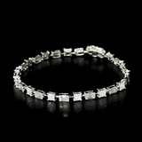 Featuring a refined arrangement of brilliant and baguette-cut diamonds, this bracelet embodies modern luxury with classic charm. (PGDBR070)