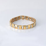 Sleek gold meets shimmering diamonds in a flexible design—crafted for effortless elegance and everyday luxury. (PGDBR073)