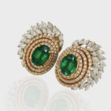 Earring pair with Radiant emeralds and diamonds intertwine in mesmerizing round and marquise cuts, set in a captivating dance of white and yellow gold.(PGDE0144)