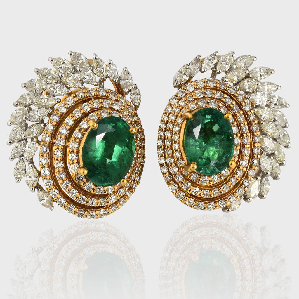 Earring pair with Radiant emeralds and diamonds intertwine in mesmerizing round and marquise cuts, set in a captivating dance of white and yellow gold.(PGDE0144)