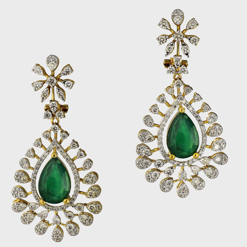 Adorn yourself in elegance with our exquisite long earring pair, featuring pear-shaped emeralds delicately embraced by shimmering diamonds (PGDE0374)