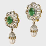 Embrace sophistication and grace with our enchanting earring pair. Featuring mesmerizing emerald-cut ovals adorned with sparkling diamonds, elegantly crowned with South Sea pearl drops accented by diamond caps.(PGDE0381)