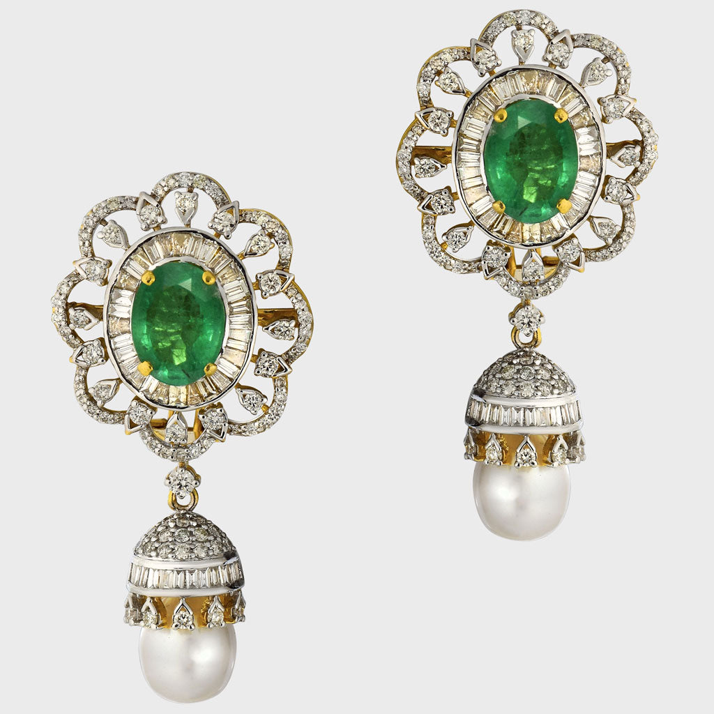 Embrace sophistication and grace with our enchanting earring pair. Featuring mesmerizing emerald-cut ovals adorned with sparkling diamonds, elegantly crowned with South Sea pearl drops accented by diamond caps.(PGDE0381)