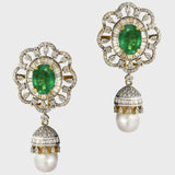 Embrace sophistication and grace with our enchanting earring pair. Featuring mesmerizing emerald-cut ovals adorned with sparkling diamonds, elegantly crowned with South Sea pearl drops accented by diamond caps.(PGDE0381)