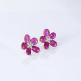 Inspired by blooming flowers, these ruby and diamond tops add a touch of color, sparkle, and sophistication to every look.(PGDE0437)