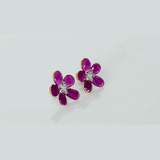 Inspired by blooming flowers, these ruby and diamond tops add a touch of color, sparkle, and sophistication to every look.(PGDE0437)