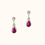 Graceful ruby pear earrings accented with brilliant diamonds, offering a classic yet luxurious style that never goes unnoticed.(PGDE0440)
