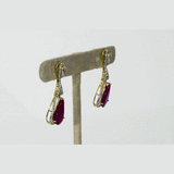 Graceful ruby pear earrings accented with brilliant diamonds, offering a classic yet luxurious style that never goes unnoticed.(PGDE0440)