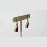 Graceful ruby pear earrings accented with brilliant diamonds, offering a classic yet luxurious style that never goes unnoticed.(PGDE0440)