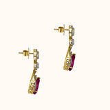 Graceful ruby pear paired with sparkling diamonds create elegant earrings that radiate beauty, brilliance, and timeless sophistication.(PGDE0442)