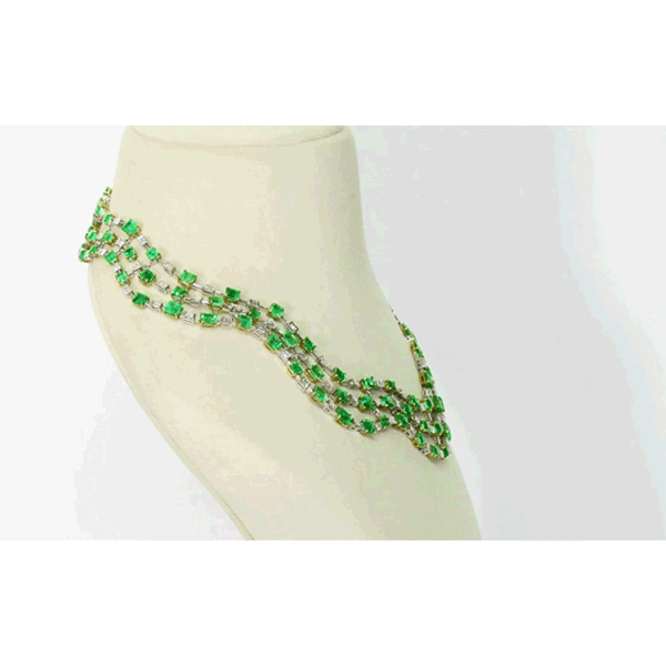 Colombian Emerald Masterpiece Exquisite necklace set featuring exceptional Colombian emeralds, brilliant round and baguette diamonds in an elegant multi-layer design, paired with graceful statement earrings radiating timeless luxury.(PGDNE057)