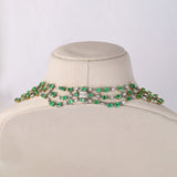 Colombian Emerald Masterpiece Exquisite necklace set featuring exceptional Colombian emeralds, brilliant round and baguette diamonds in an elegant multi-layer design, paired with graceful statement earrings radiating timeless luxury.(PGDNE057)