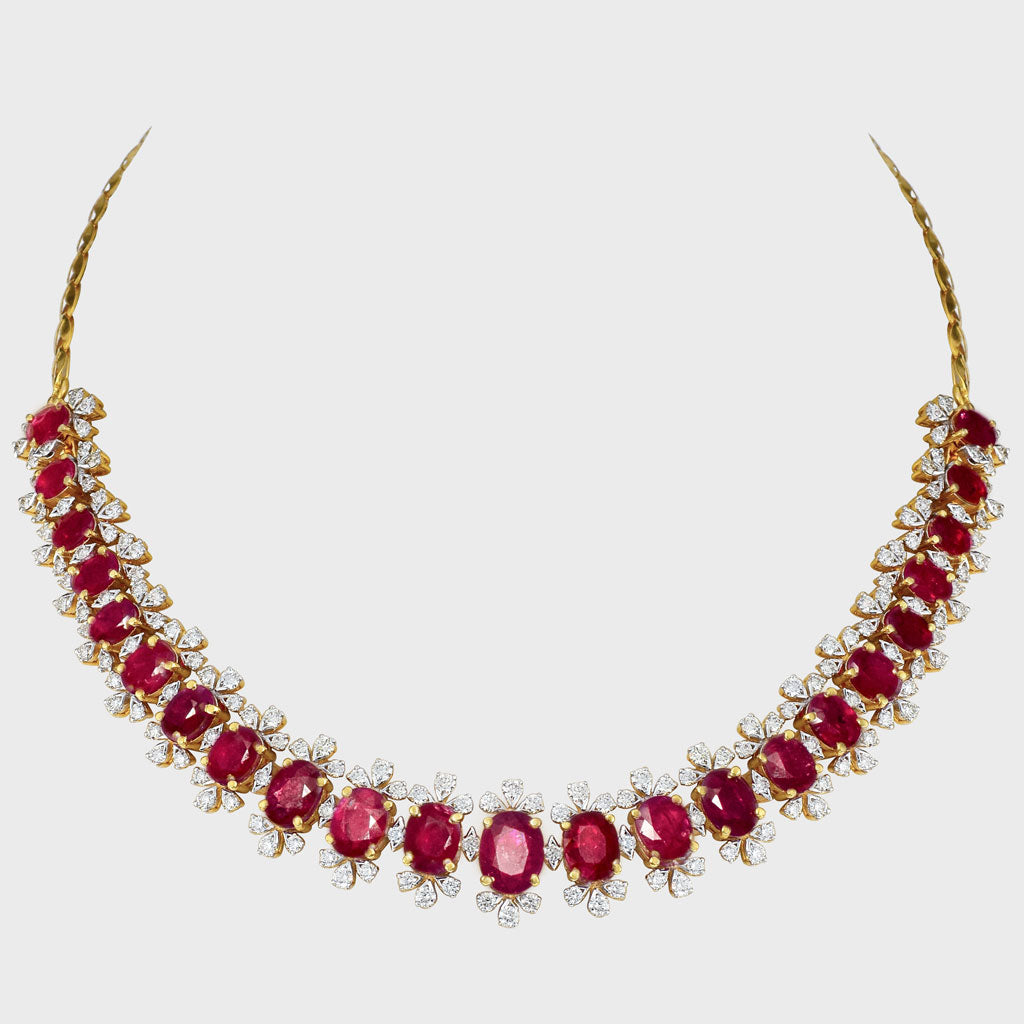 Embrace luxury and allure with our Ruby oval and diamond Necklace cum Bracelet set. Radiating elegance and sophistication, this exquisite ensemble effortlessly blends classic charm with modern glamour.(PGDNE0126)