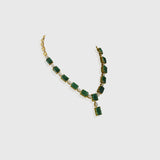 Exquisite necklace and earring pair featuring octagon-shaped emeralds accented with sparkling round diamonds—a perfect blend of luxury, elegance, and timeless beauty for any special occasion.(PGDNE0143)