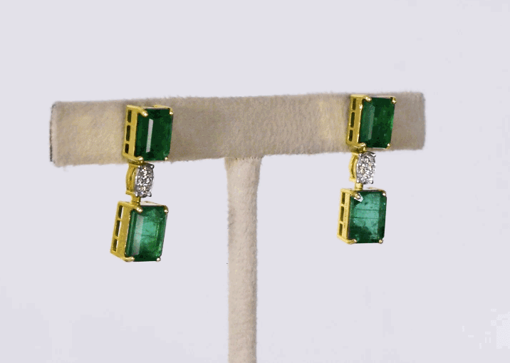 Exquisite necklace and earring pair featuring octagon-shaped emeralds accented with sparkling round diamonds—a perfect blend of luxury, elegance, and timeless beauty for any special occasion.(PGDNE0143)