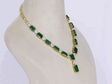Exquisite necklace and earring pair featuring octagon-shaped emeralds accented with sparkling round diamonds—a perfect blend of luxury, elegance, and timeless beauty for any special occasion.(PGDNE0143)
