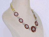 Graceful necklace and tops pair featuring oval rubies and round diamonds, highlighted by a stunning mutual cut diamond solitaire at the center—elegant, timeless, and truly captivating.(PGDNE0144)