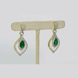 A beautifully crafted pendant and earring set featuring pear-shaped emeralds, diamonds, and mother-of-pearl, blending vibrant colour with delicate design for luxurious elegance. (PGDPE0119)