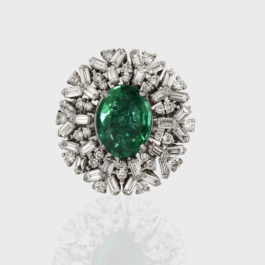 Emerald and Diamond Ring, featuring captivating oval emeralds and sparkling diamond baguettes and round. Each exquisite detail is meticulously crafted to exude elegance and charm, making it the perfect statement piece for any occasion.(PGDR0365)