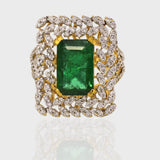 Emerald Octagon and Diamond Round Ring, Crafted to perfection, this exquisite piece harmonizes the allure of a striking octagonal emerald with the brilliance of surrounding diamond rounds.(PGDR0370)