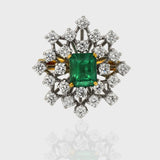 Ring, a captivating union of elegance and luxury, adorned with a stunning Emerald embraced by shimmering Diamonds.(PGDR0416)
