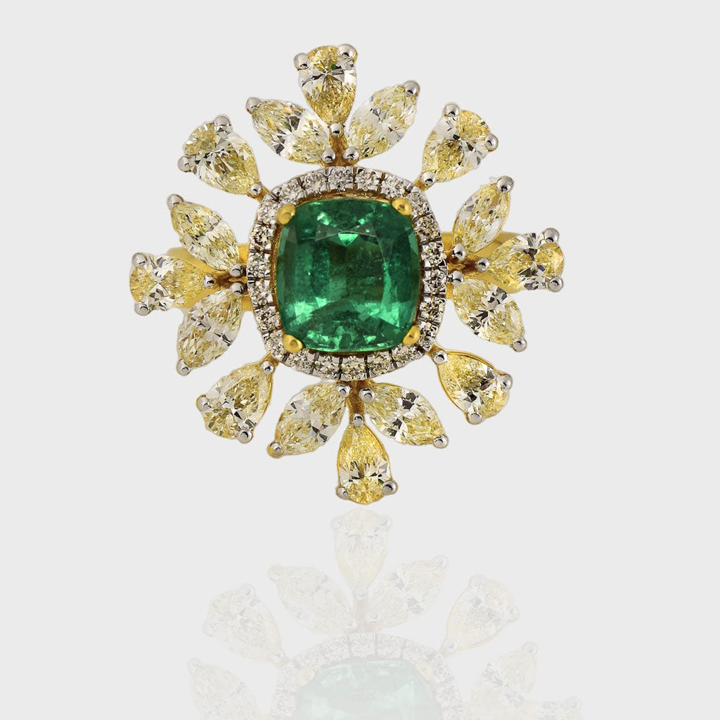 Introducing our exquisite Ring, a masterpiece of unparalleled beauty and sophistication, adorned with a fine quality Emerald and an array of multi-shaped Diamonds.(PGDR0434)