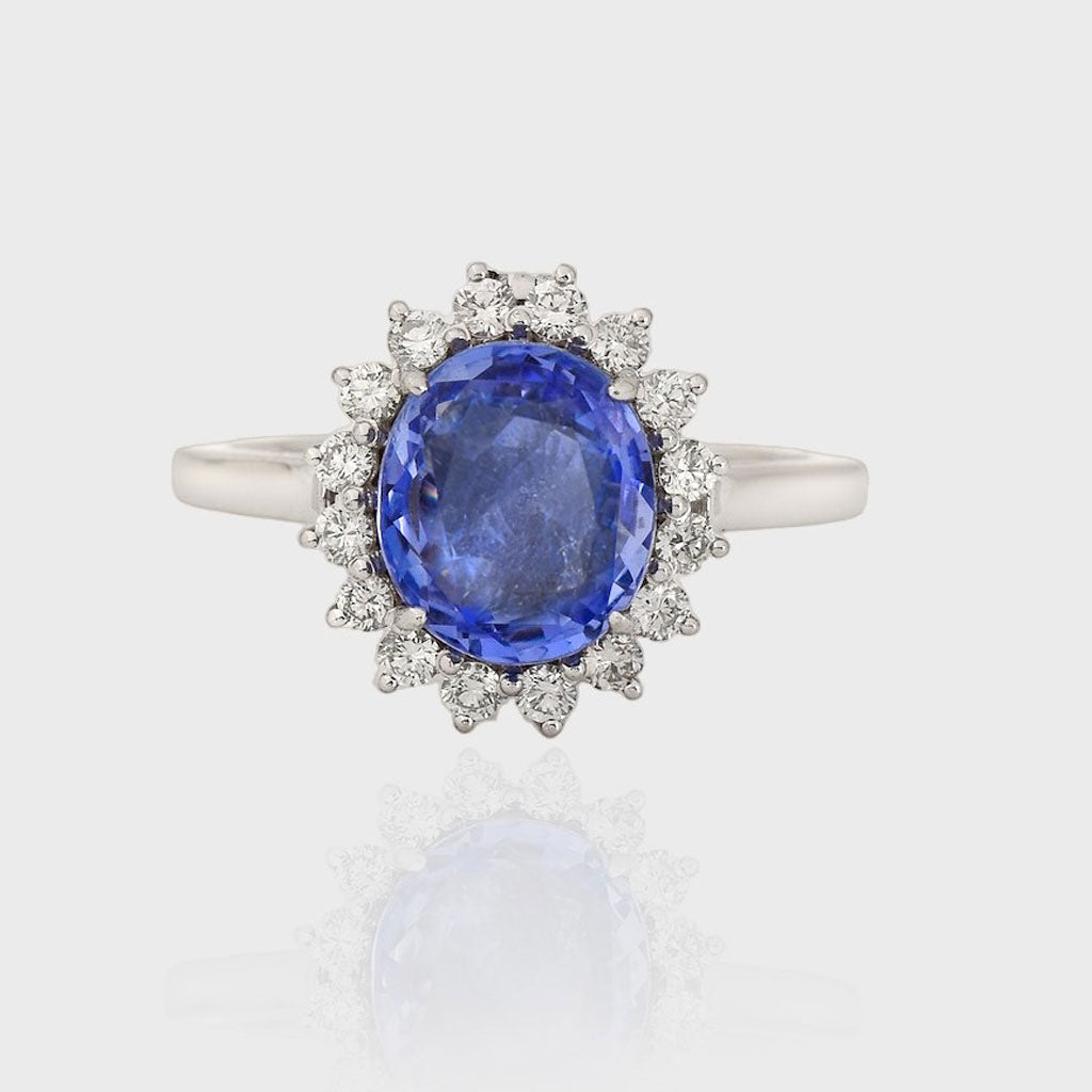 Diamond Ring featuring a captivating oval-cut Blue Sapphire at its heart, exuding timeless elegance and sophistication.(PGDR0439)