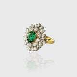 Stunning ring with vivid oval emerald of exceptional color and quality, accented by sparkling diamonds—elegant and timeless for every occasion.(PGDR0459)
