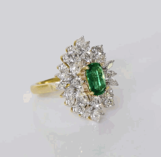 Stunning ring with vivid oval emerald of exceptional color and quality, accented by sparkling diamonds—elegant and timeless for every occasion.(PGDR0459)