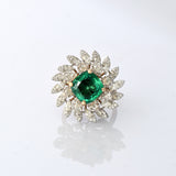 A fine emerald centerpiece surrounded by sparkling diamonds, creating a graceful ring that radiates timeless elegance and brilliance.(PGDR0460)
