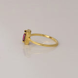 Celebrate timeless beauty with an emerald-cut pink tourmaline ring, gracefully highlighted by a shimmering halo of brilliant round diamonds.(PGDR0472)