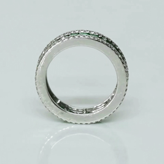 A timeless eternity band showcasing vivid channel-set emeralds, framed by brilliant round diamonds for an elegant statement of everlasting luxury.(PGDR0510)