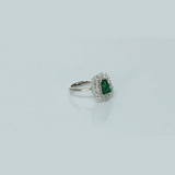 A fine emerald centerpiece surrounded by sparkling diamonds, creating a timeless ring filled with elegance, beauty, and charm.(PGDR0511)