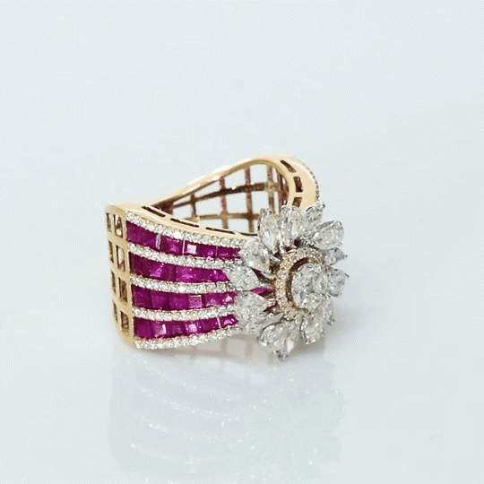 A radiant bloom of brilliant diamonds set against layers of rich rubies—crafted to make every moment shine. (PGDR0515)