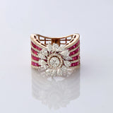 A radiant bloom of brilliant diamonds set against layers of rich rubies—crafted to make every moment shine. (PGDR0515)