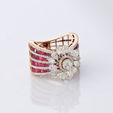 A radiant bloom of brilliant diamonds set against layers of rich rubies—crafted to make every moment shine. (PGDR0515)