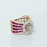 A radiant bloom of brilliant diamonds set against layers of rich rubies—crafted to make every moment shine. (PGDR0515)