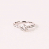 A timeless solitaire diamond ring with a brilliant round center stone and diamond-studded band, crafted for everlasting elegance.(PGDR0533)