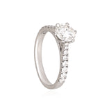 A timeless solitaire diamond ring with a brilliant round center stone and diamond-studded band, crafted for everlasting elegance.(PGDR0533)